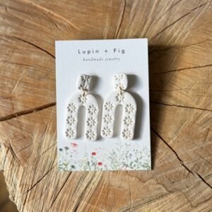 white flower stamped arc polymer clay earrings
